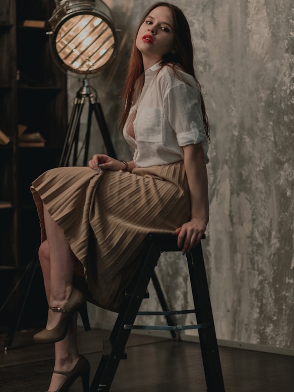 Gonna a pieghe in satin lucido